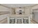 Kitchen with white cabinets, granite countertops, and stainless steel appliances at 10117 Colubrina Dr, Venice, FL 34293