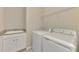 Laundry room with washer, dryer, and utility sink at 10117 Colubrina Dr, Venice, FL 34293