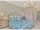 Main bedroom with king-size bed, dresser, and en-suite bathroom access at 10117 Colubrina Dr, Venice, FL 34293