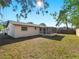 Expansive backyard with a screened-in lanai offers great outdoor living space at 1023 Hope St, Venice, FL 34285