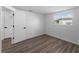 Bedroom featuring modern floors, white walls, and a window with window blinds at 1023 Hope St, Venice, FL 34285