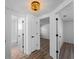 Hallway with decorative lighting leads to rooms; bedroom, bathroom at 1023 Hope St, Venice, FL 34285