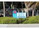 Welcoming Venice Beach sign surrounded by lush greenery and palm trees for a scenic entrance at 1023 Hope St, Venice, FL 34285