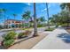 Picturesque street view with palm trees and well-maintained sidewalks in a charming neighborhood at 1023 Hope St, Venice, FL 34285