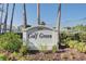 Welcoming Golf Green sign amidst lush landscaping and palm trees, marking this desirable community at 1041 Capri Isles Blvd # 119, Venice, FL 34292