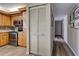 View of hallway and laundry closet in kitchen area at 1041 Capri Isles Blvd # 119, Venice, FL 34292