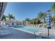 Beautiful community pool with shade from mature palm trees at 1041 Capri Isles Blvd # 119, Venice, FL 34292