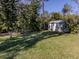 Well-maintained shed in a lush green backyard at 1093 Laurel Woods Dr, Nokomis, FL 34275