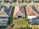 Aerial view of the backyard showcasing its size, screened-in lanai, and well-maintained surroundings, perfect for outdoor enjoyment at 11903 Alessandro Ln, Venice, FL 34293