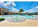 Community pool features a jacuzzi, beach entry, palm trees, and plenty of room for swimming at 11903 Alessandro Ln, Venice, FL 34293