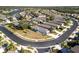 Aerial view of a community showcasing home sites and landscaping at 11915 Tempest Harbor Loop, Venice, FL 34292