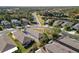 Aerial view of a community showcasing home sites, landscaping, and lake view at 11915 Tempest Harbor Loop, Venice, FL 34292