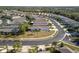 Aerial view of a well-maintained neighborhood and landscaping at 11915 Tempest Harbor Loop, Venice, FL 34292