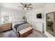 Bedroom with board and batten accent wall, ceiling fan, and full bedroom set at 11915 Tempest Harbor Loop, Venice, FL 34292