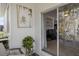 Outdoor patio area featuring greenery and sliding glass door entry into the home's interior at 11915 Tempest Harbor Loop, Venice, FL 34292