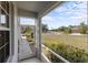 Screened-in porch overlooking a well-maintained neighborhood street with lush landscaping at 11915 Tempest Harbor Loop, Venice, FL 34292