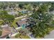 Aerial view of property showing home, backyard with privacy fence, and surrounding neighborhood at 1212 Mango Ave, Venice, FL 34285