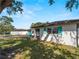 Charming single-story home with a well-manicured lawn and a quaint screened-in porch at 1212 Mango Ave, Venice, FL 34285