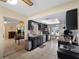 Well-lit kitchen with stainless steel appliances, dark cabinets, and a breakfast nook with a large skylight at 1212 Mango Ave, Venice, FL 34285