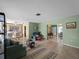 Inviting living room showcasing an open layout with tiled floors and natural light, perfect for entertaining guests at 1212 Mango Ave, Venice, FL 34285