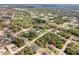 Overhead view of a property nestled in a verdant, wooded community, offering a peaceful retreat at 1232 Marilyn Ln, North Port, FL 34286