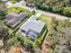 Overhead view of a house showcasing a pool and lush, tropical backyard. The neighborhood is quiet at 1232 Marilyn Ln, North Port, FL 34286