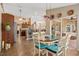 Sunlit dining area adjacent to the kitchen features a modern table with seating for six at 1232 Marilyn Ln, North Port, FL 34286