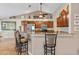 Kitchen with a breakfast bar, tile floors and dark wood cabinets at 1232 Marilyn Ln, North Port, FL 34286