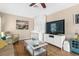 Relaxing living room area with Murphy bed, comfortable chairs, and natural light at 1232 Marilyn Ln, North Port, FL 34286