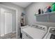 Laundry room with washer, dryer, and utility sink at 12385 Prudential Ave, Port Charlotte, FL 33981