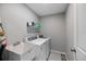 Laundry room with washer, dryer, and shelving at 12385 Prudential Ave, Port Charlotte, FL 33981