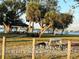 Exterior shot of Gulf Cove's private park with picnic spots, mature trees, and a serene waterfront view at 12385 Prudential Ave, Port Charlotte, FL 33981