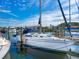 Sailboat docked in a marina with blue skies in the background at 128 Sea Anchor Dr, Osprey, FL 34229