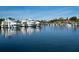 Large boats docked in the marina and waterfront homes at 128 Sea Anchor Dr, Osprey, FL 34229