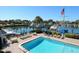 Poolside lounge with comfortable seating overlooking the marina, complete with an American Flag at 128 Sea Anchor Dr, Osprey, FL 34229