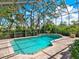 Enclosed in-ground pool with brick pavers and screened for added privacy and relaxation at 128 Sea Anchor Dr, Osprey, FL 34229