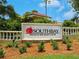 Well-maintained Southbay Yacht & Racquet Club sign surrounded by manicured landscaping at 128 Sea Anchor Dr, Osprey, FL 34229