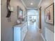 Hallway featuring hardwood floors, decor, an archway, and a peek into the living room at 13194 Borrego St, Venice, FL 34293