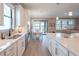 Kitchen featuring a large island with pendant lighting, stainless steel appliances, and an open floor plan at 13194 Borrego St, Venice, FL 34293