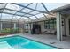 A view of the screened-in pool and patio area showcasing the outdoor living space at 13194 Borrego St, Venice, FL 34293