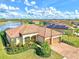 Single-story home with tile roof and lake view at 13376 Caravaggio Ct, Venice, FL 34293