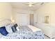 Bright bedroom with a queen-size bed and a large closet at 13376 Caravaggio Ct, Venice, FL 34293