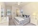 Bedroom with queen bed and private bathroom access at 13376 Caravaggio Ct, Venice, FL 34293