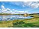 Tranquil lake view showcasing multiple residences and beautiful reflections at 13376 Caravaggio Ct, Venice, FL 34293