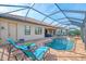 Spacious pool and spa with covered patio and lake view at 13376 Caravaggio Ct, Venice, FL 34293