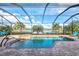 Enclosed pool and spa area with lake view at 13376 Caravaggio Ct, Venice, FL 34293