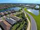 Aerial view of a house in a neighborhood with lakes at 13463 Nobilio St, Venice, FL 34293