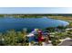 Aerial view of lakefront Downtown area with dock and community building at 13463 Nobilio St, Venice, FL 34293