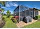 Screened patio with grill and plenty of space for outdoor living at 13463 Nobilio St, Venice, FL 34293