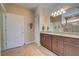 Elegant bathroom with double vanity and granite countertops at 13463 Nobilio St, Venice, FL 34293